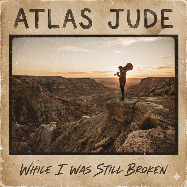 Atlas Jude's shared While I Was Still Broken cover: a lone traveler carrying a guitar above a sunset canyon, framed in worn cream paper.